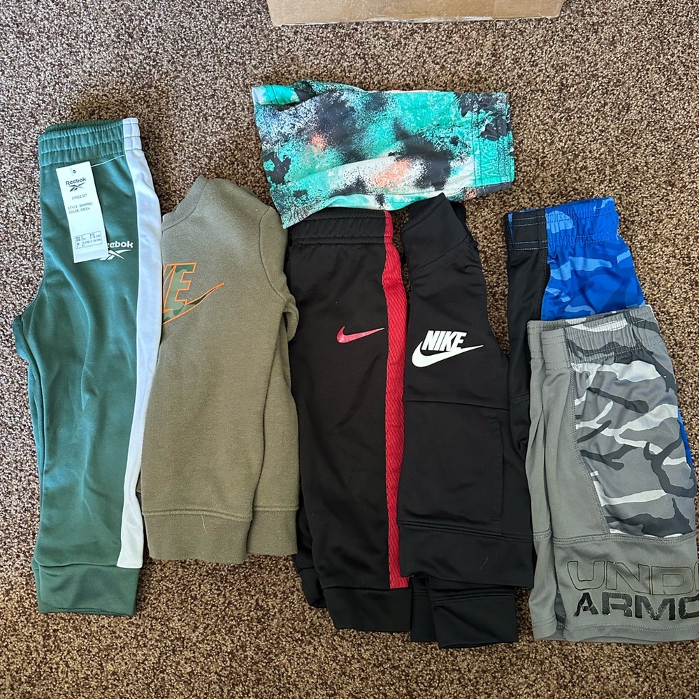 Under Armour/ Nike/Reebok Kids Athletic Bundle Pre Loved and New. 7 pieces.